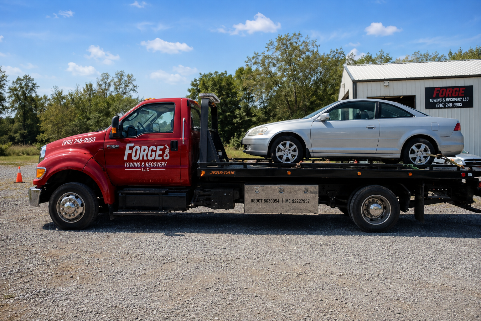 Forge Towing & Recovery flatbed towing a silver coupe